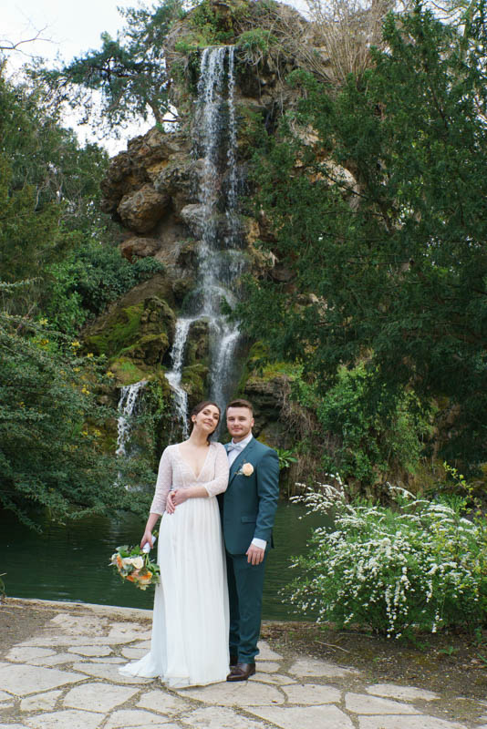 Couple photoshoot at Bagatelle Gardens Paris — waterfall and rocks